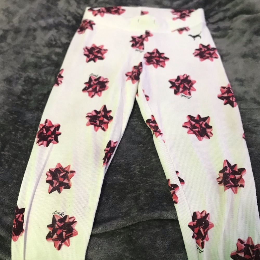 white and red pajama pants with bows on them